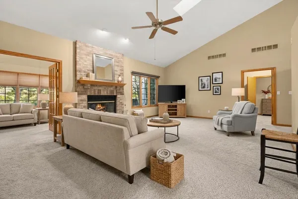an empty room with furniture and a fireplace