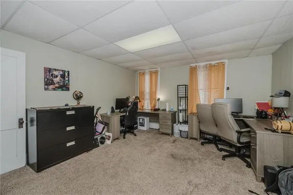 a view of a workspace with furniture and toys