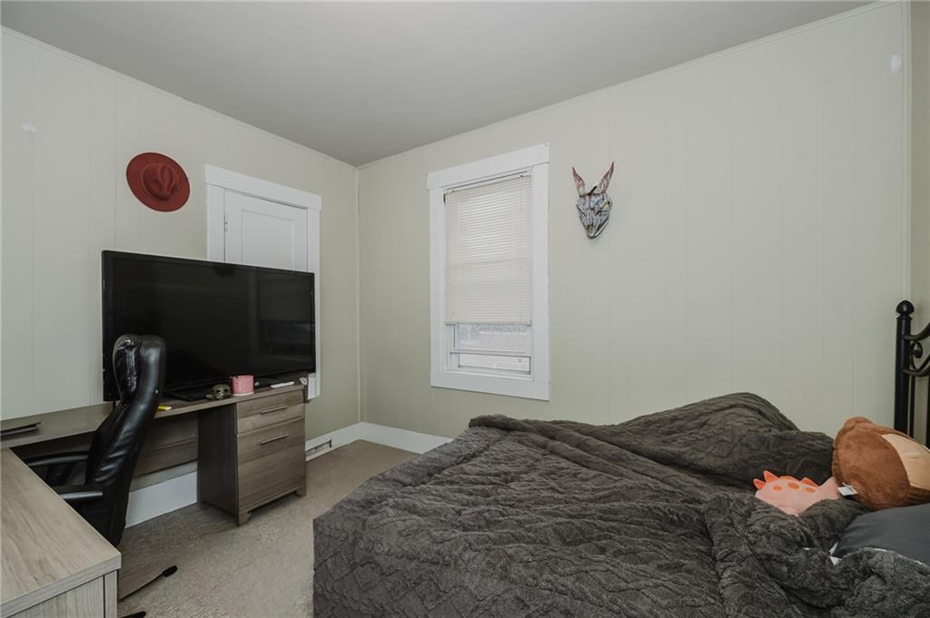 1302 Philadelphia Street Indiana, PA 15701 - Photo 18 of 30 a bedroom with a bed and flat screen tv