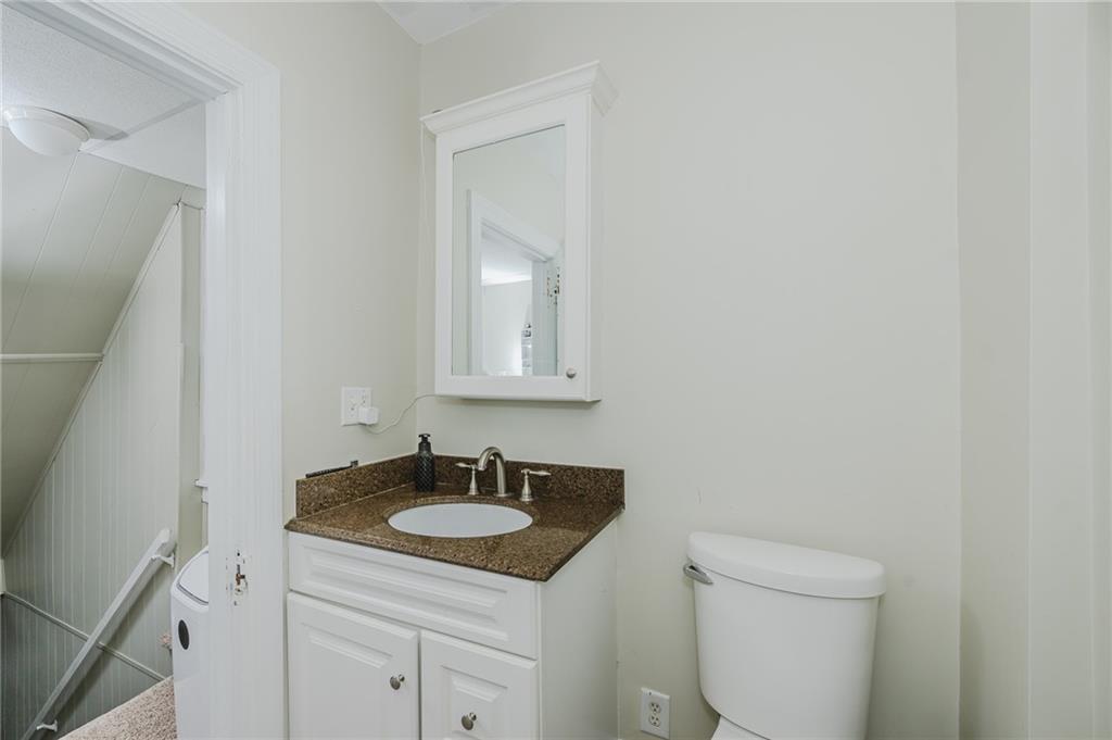 1302 Philadelphia Street Indiana, PA 15701 - Photo 19 of 30 a bathroom with a granite countertop sink and a toilet