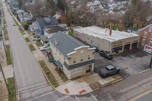 an aerial view of a house with a garden