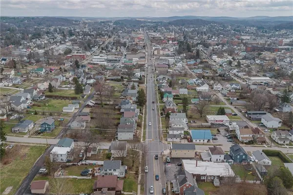 an aerial view of houses with outdoor space