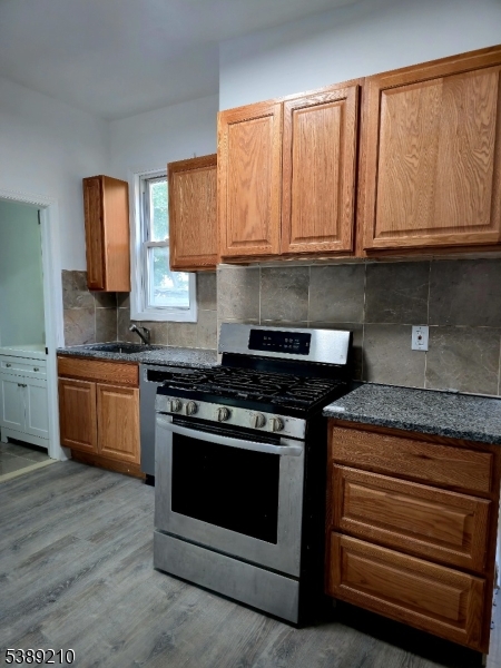 204 Chancellor Avenue, Unit 1 Newark, NJ 07112 - Photo 1 of 6 a stove top oven sitting inside of a kitchen