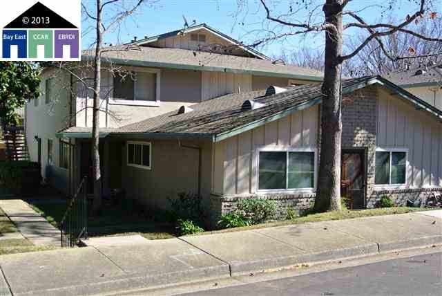 2365 Foothill Road, Unit 2 Pleasanton, CA 94588 - Photo 1 of 1 a view of a white house with large windows and a small yard