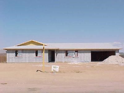 13177 Topock Road Apple Valley, CA 92308 - Photo 1 of 1 a view of a house with large windows