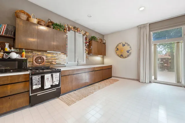 a kitchen with a stove and a cabinets