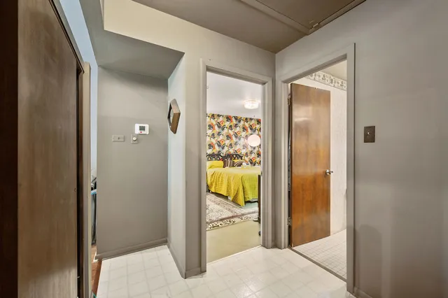 a view of a bathroom from a hallway