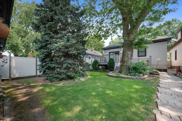 a view of a house with a back yard