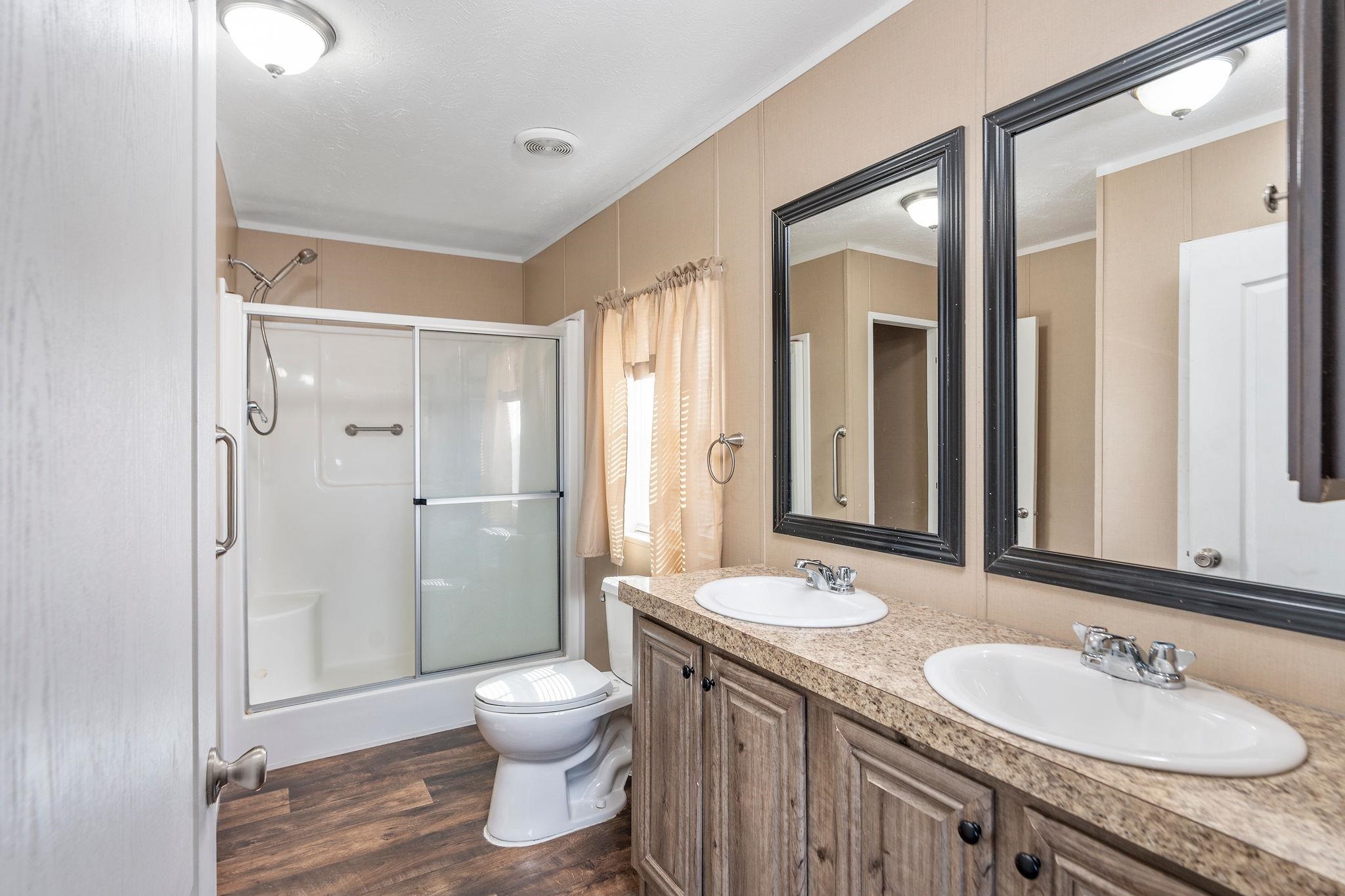 2061 Cecil Wampler Road Mount Crawford, VA 22841 - Photo 36 of 70 a bathroom with a granite countertop sink toilet a large mirror a vanity and shower