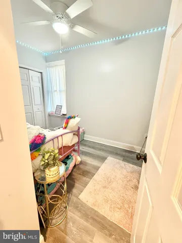 a bed room with a bed and a window