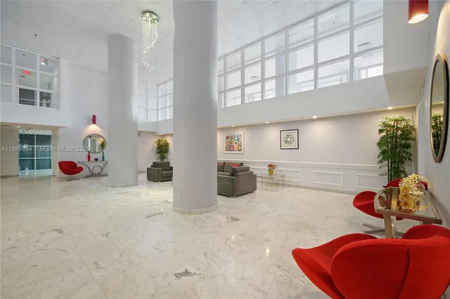 a room with furniture and flower pot