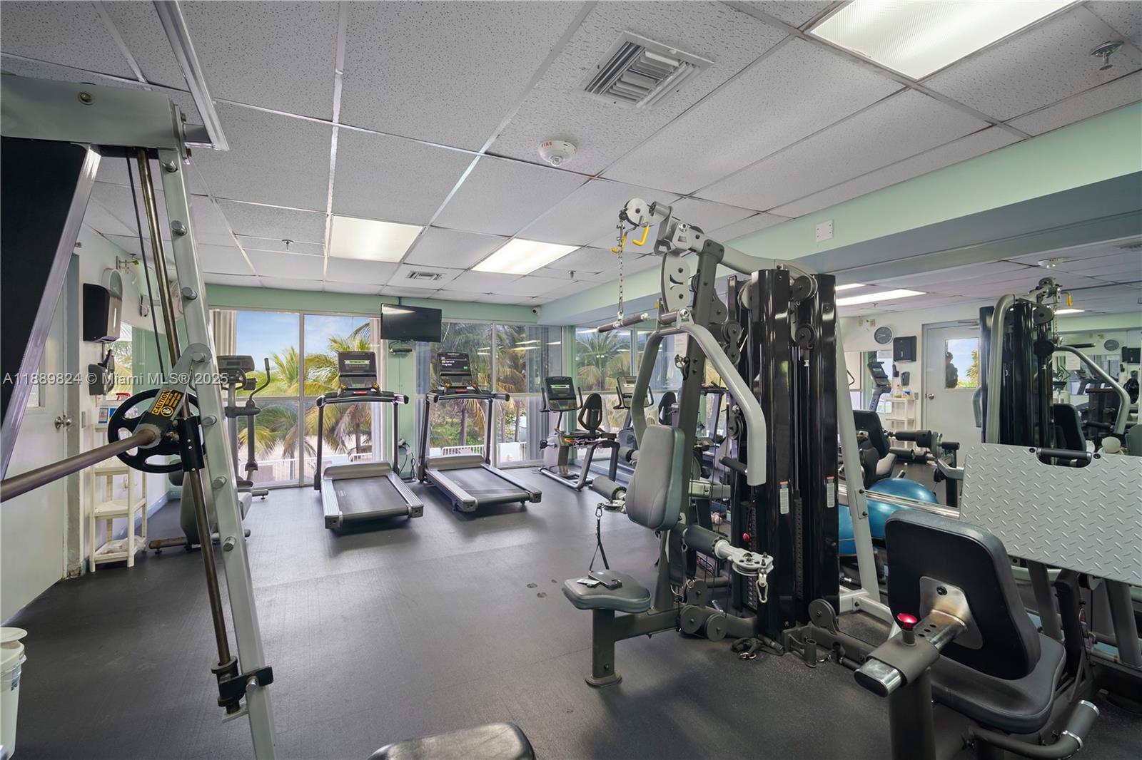 9341 Collins Avenue, Unit 205 Surfside, FL 33154 - Photo 26 of 33 a view of a room with gym equipment
