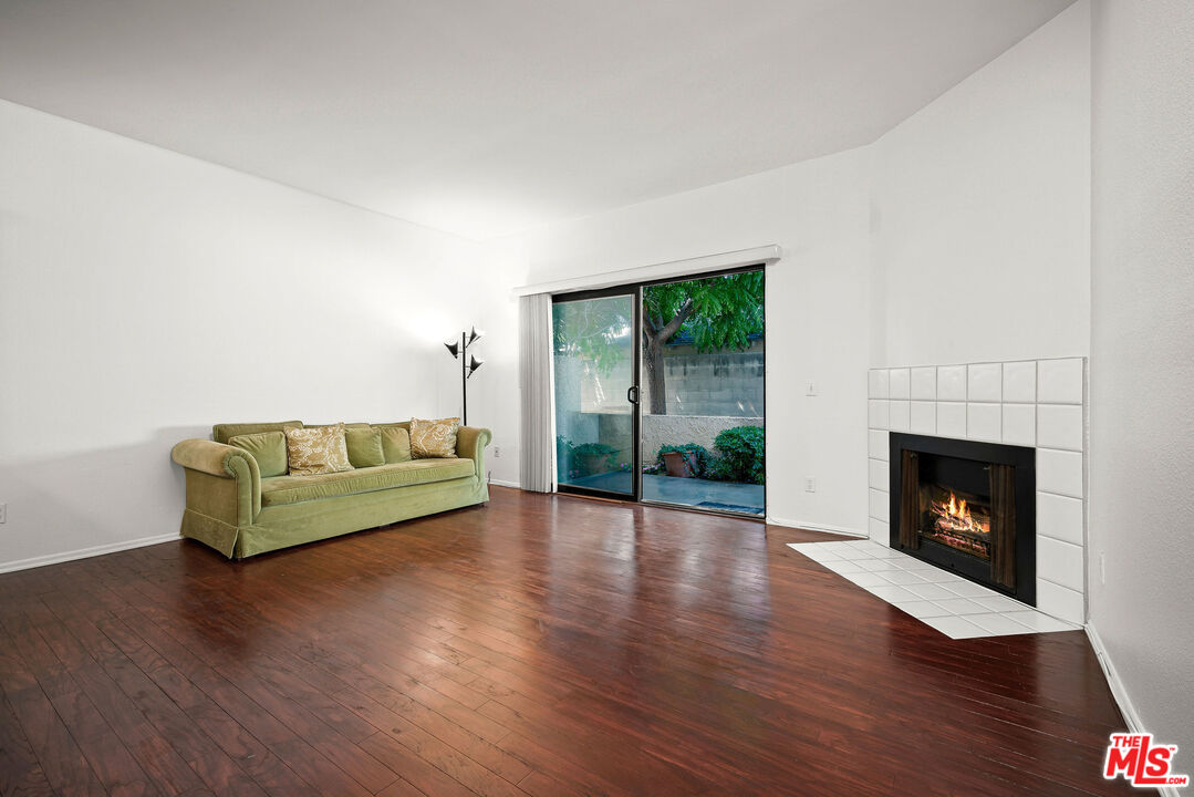 2491 Purdue Avenue, Unit 105 Los Angeles, CA 90064 - Photo 18 of 36 a living room with furniture and a fireplace