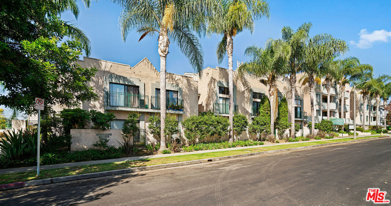 2491 Purdue Avenue, Unit 105 Los Angeles, CA 90064 - Photo 2 of 36 a view of a street with a building in the background