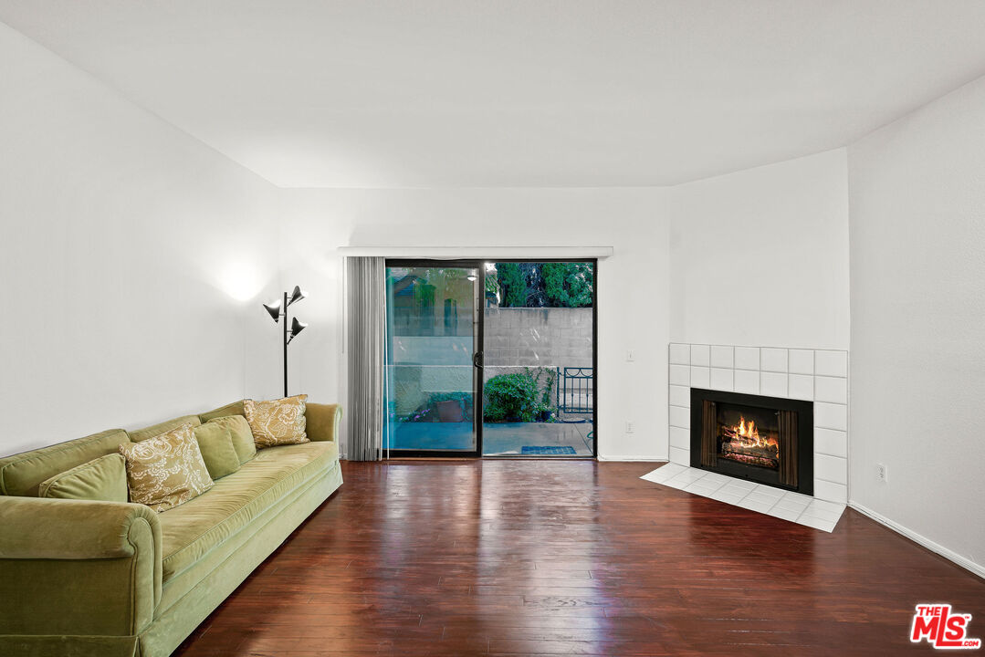 2491 Purdue Avenue, Unit 105 Los Angeles, CA 90064 - Photo 22 of 36 a living room with furniture and a fireplace