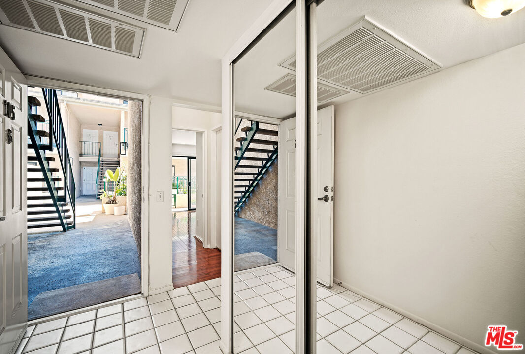 2491 Purdue Avenue, Unit 105 Los Angeles, CA 90064 - Photo 27 of 36 a view of a hallway view with staircase