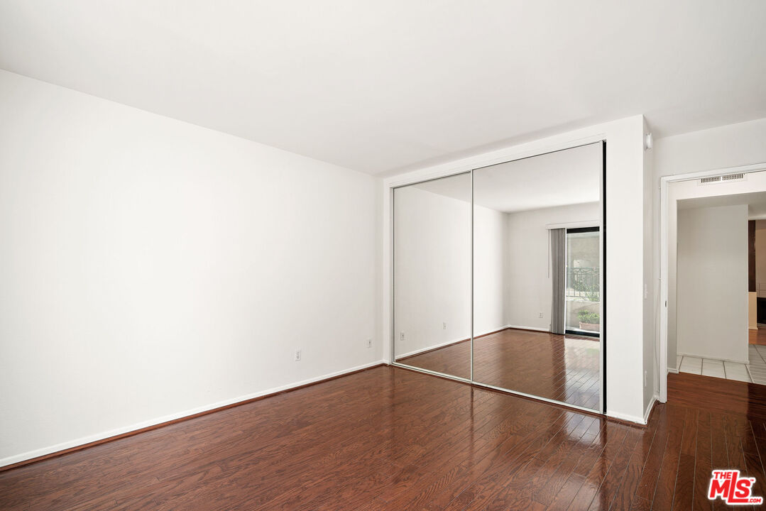2491 Purdue Avenue, Unit 105 Los Angeles, CA 90064 - Photo 30 of 36 a view of empty room with wooden floor