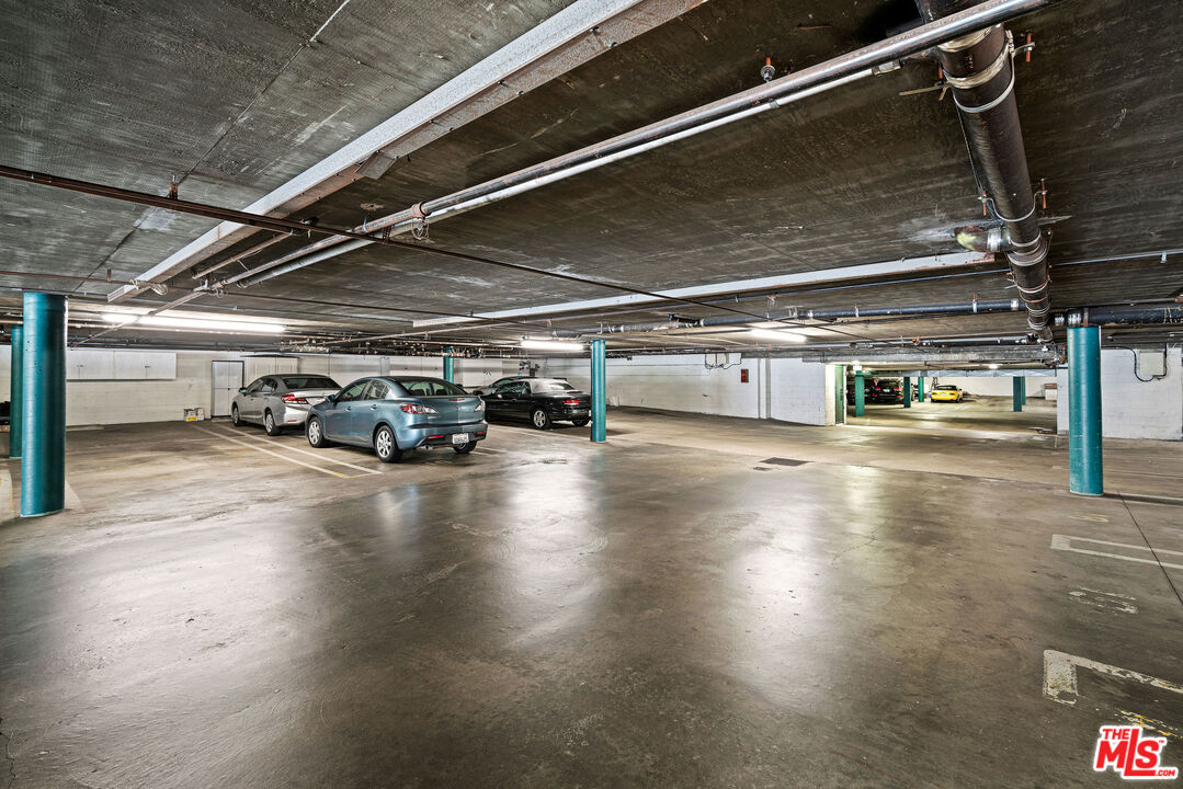 2491 Purdue Avenue, Unit 105 Los Angeles, CA 90064 - Photo 32 of 36 a car parked in a parking lot