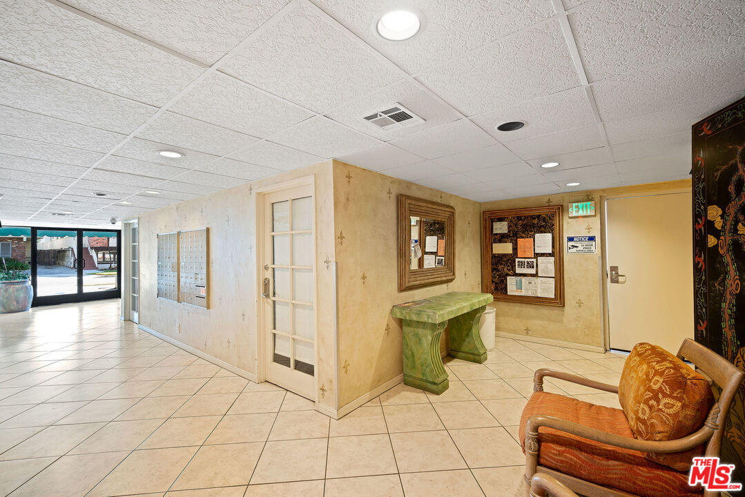 2491 Purdue Avenue, Unit 105 Los Angeles, CA 90064 - Photo 34 of 36 a living room with furniture and a couch
