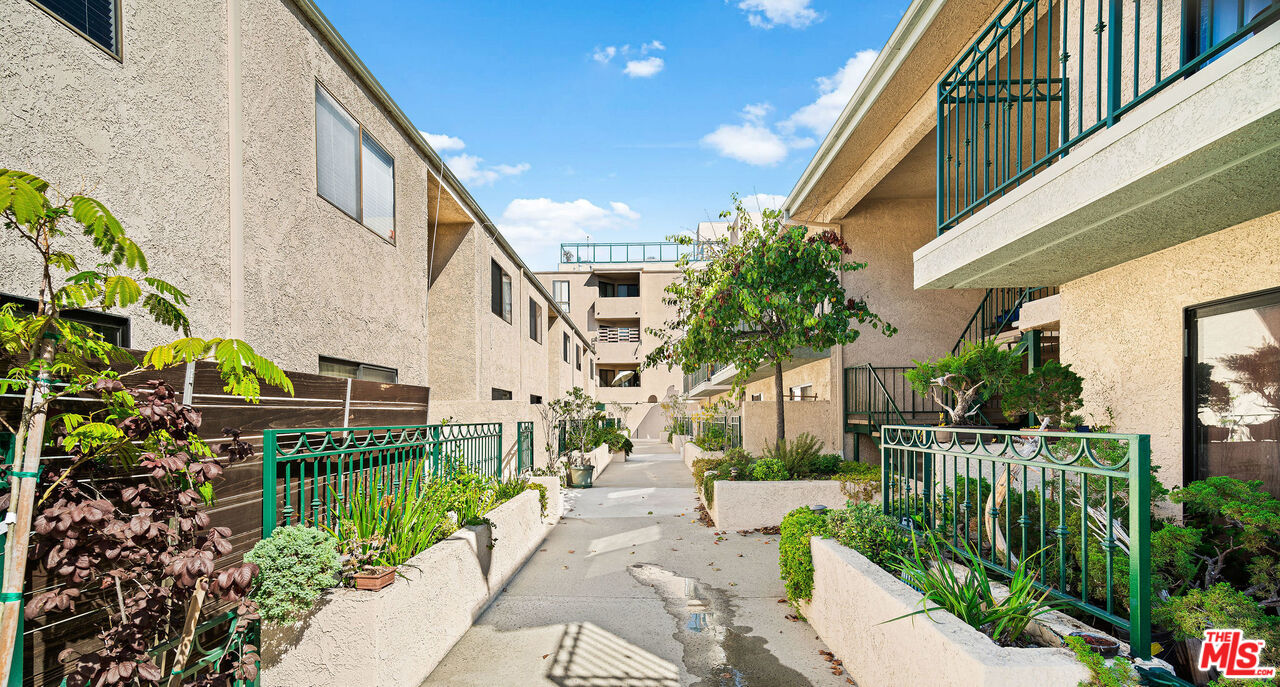 2491 Purdue Avenue, Unit 105 Los Angeles, CA 90064 - Photo 8 of 36 a view of pathway along with potted plants