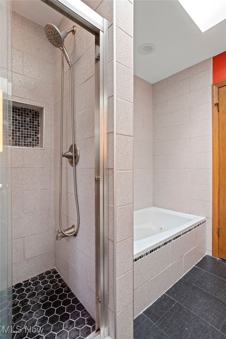4694 Ranchwood Road Akron, OH 44333 - Photo 31 of 44 Bathroom featuring a stall shower, a whirlpool tub, and tile patterned flooring