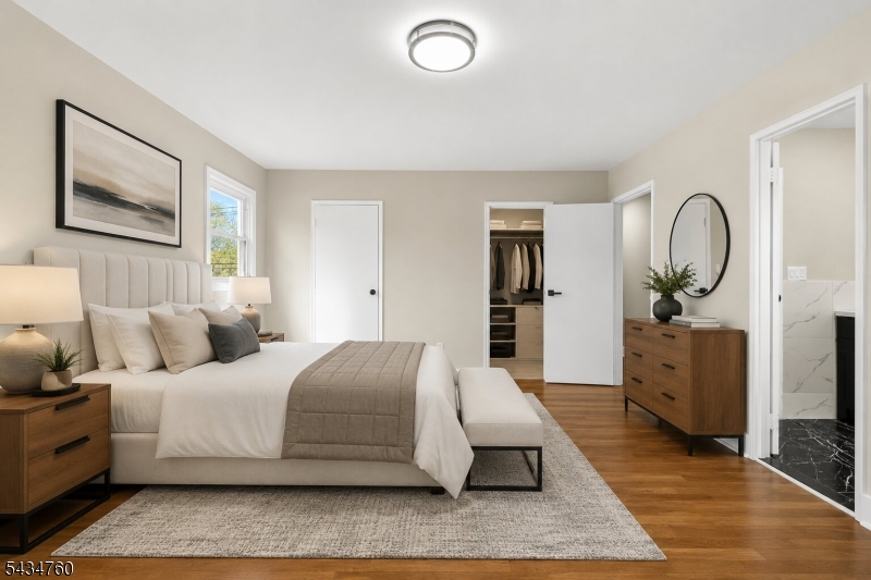 641 Ydv-ham Sq Road Robbinsville, NJ 08691 - Photo 6 of 49 a bedroom with a large bed and wooden floor