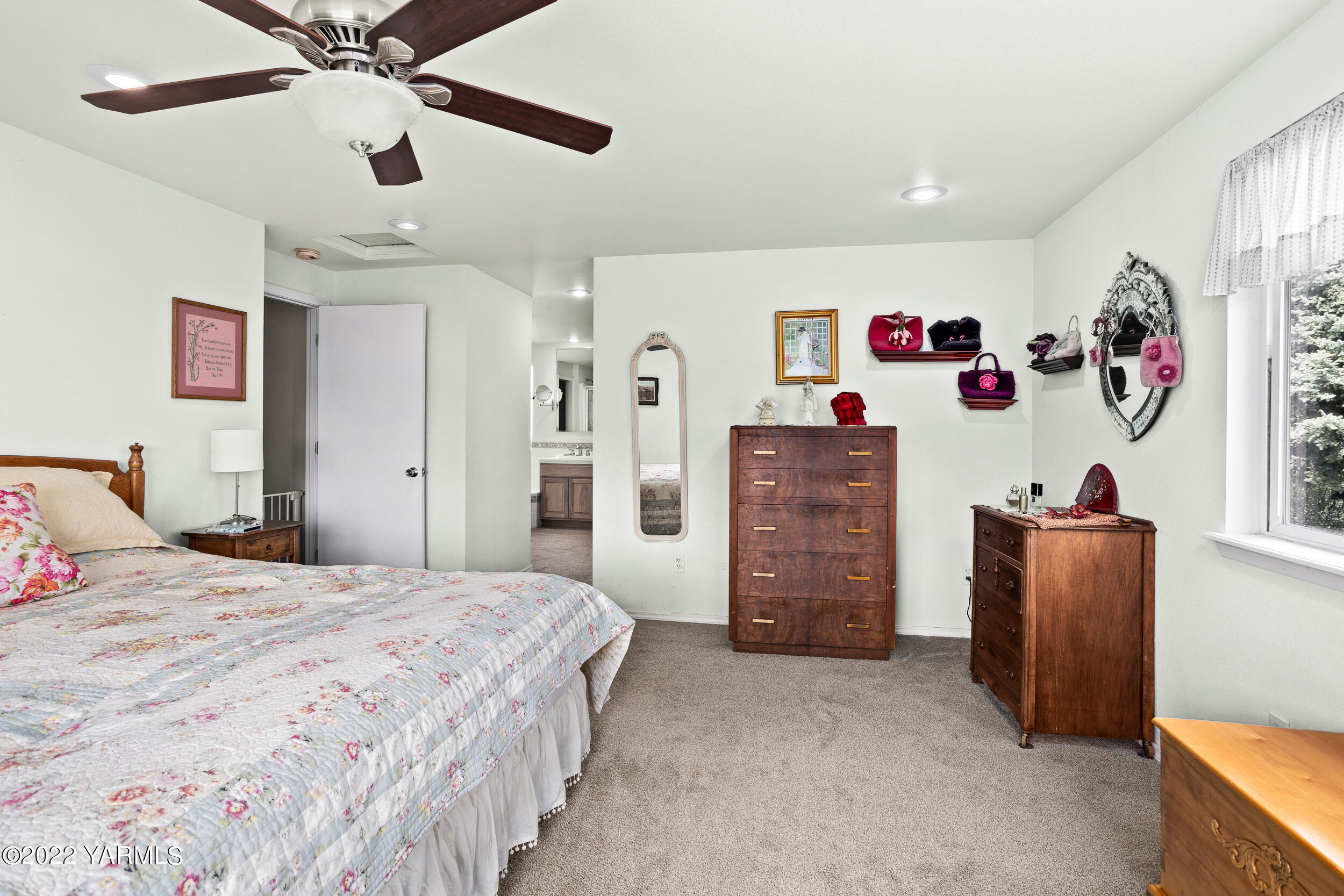 161 Track Road Cowiche, WA 98923 - Photo 19 of 51 a bedroom with a bed and a chandelier