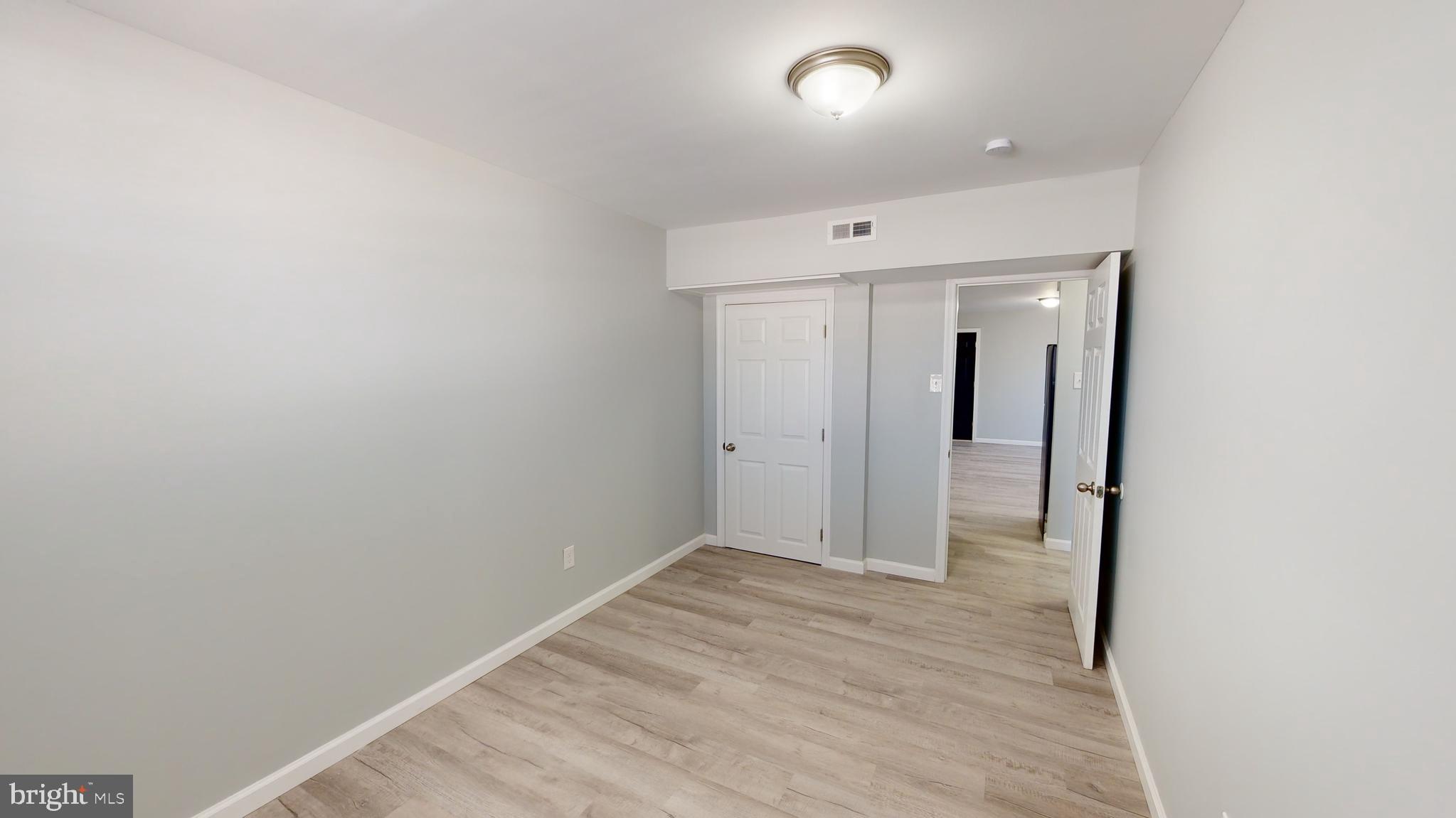 910 Gateway Boulevard, Unit C2 Westville, NJ 08093 - Photo 5 of 11 a view of hallway with wooden floor