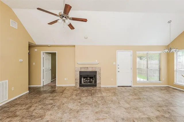 a view of an empty room with a fireplace