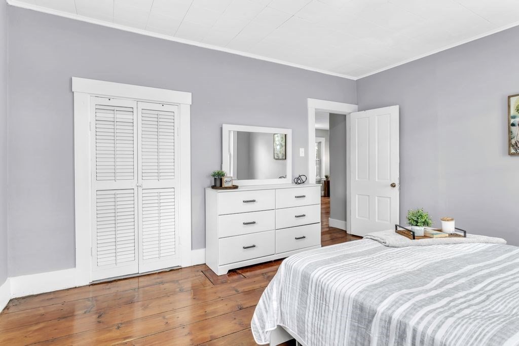 49 Pochassic Street Westfield, MA 01085 - Photo 17 of 24 a bedroom with a bed and a dresser