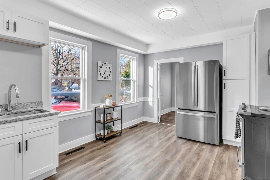 49 Pochassic Street Westfield, MA 01085 - Photo 3 of 24 a kitchen with stainless steel appliances granite countertop a refrigerator and a sink