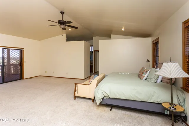 a bedroom with a bed and dresser