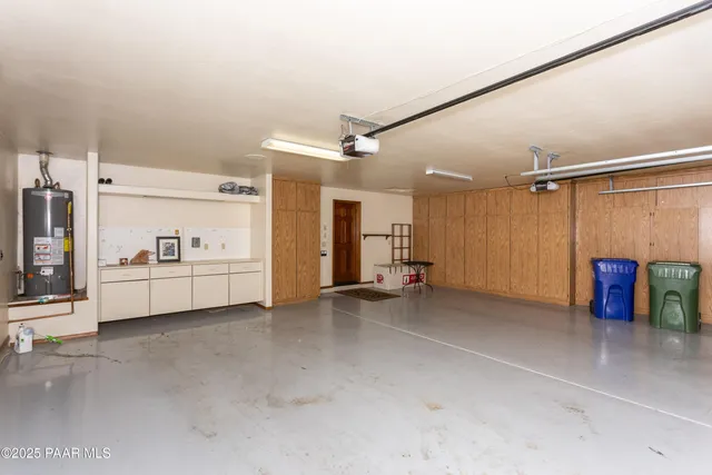 a view of a livingroom with furniture and a ceiling fan