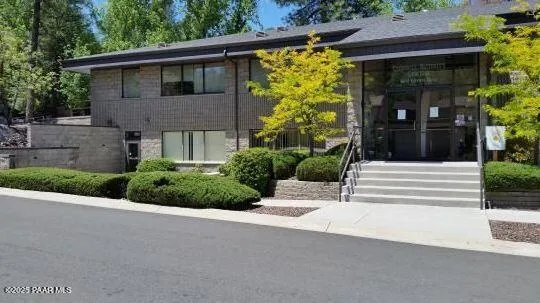 a view of a house with potted plants