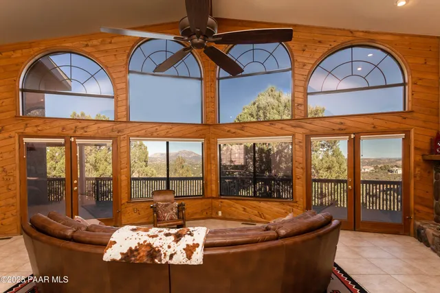 a room with furniture and a large window