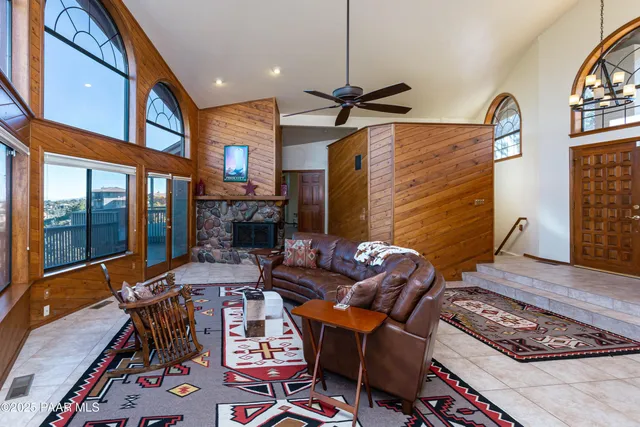 a living room with furniture a rug and a fireplace