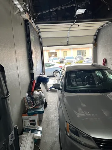 a front view of a house with parking space