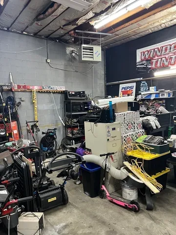 a view of a room with wooden floor and window