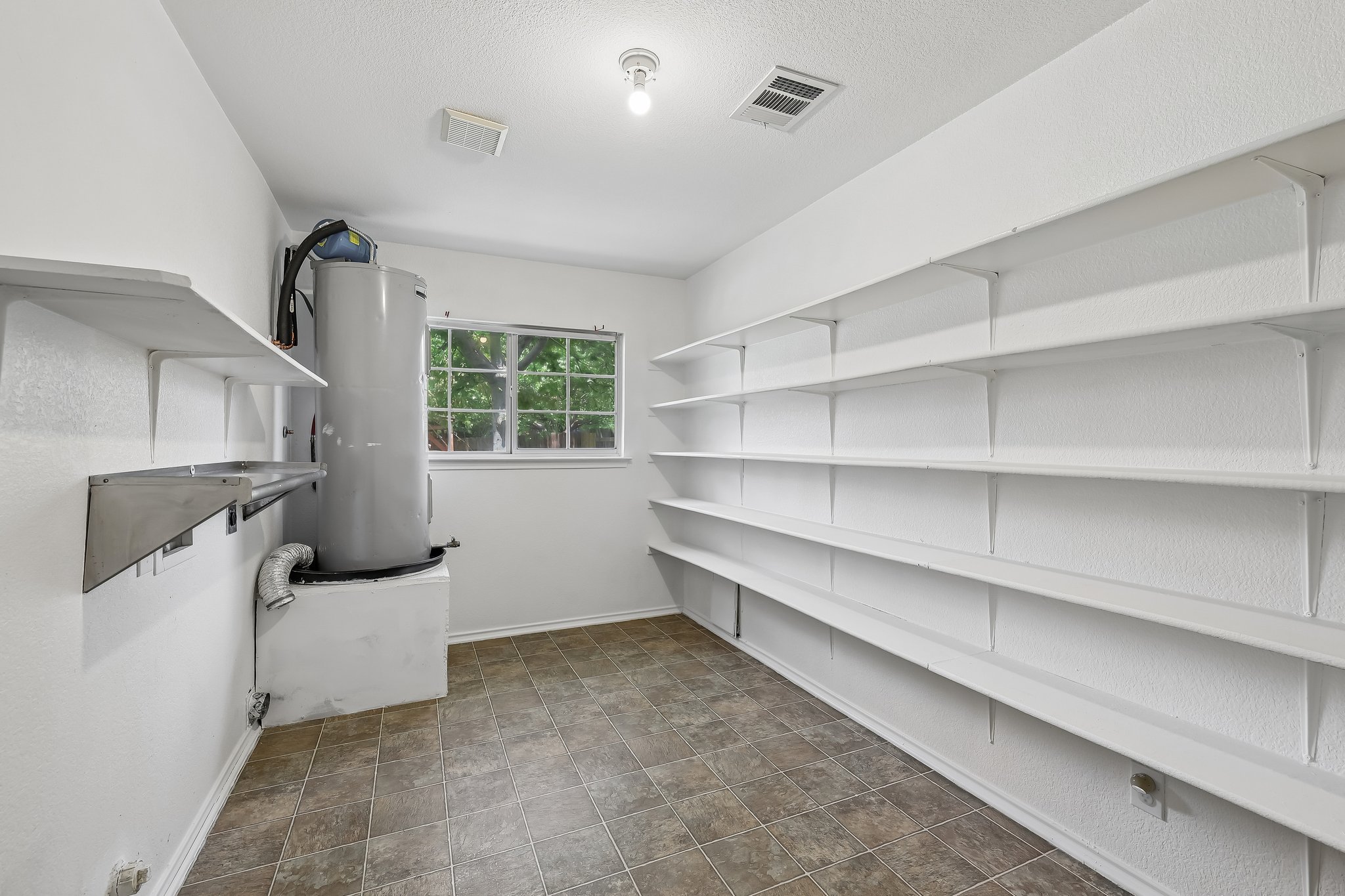 7658 Marble Ridge Drive Austin, TX 78747 - Photo 14 of 34 a view of an empty room with a window