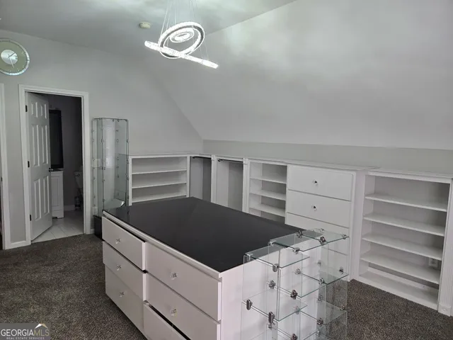 a kitchen with a cabinets and a stove