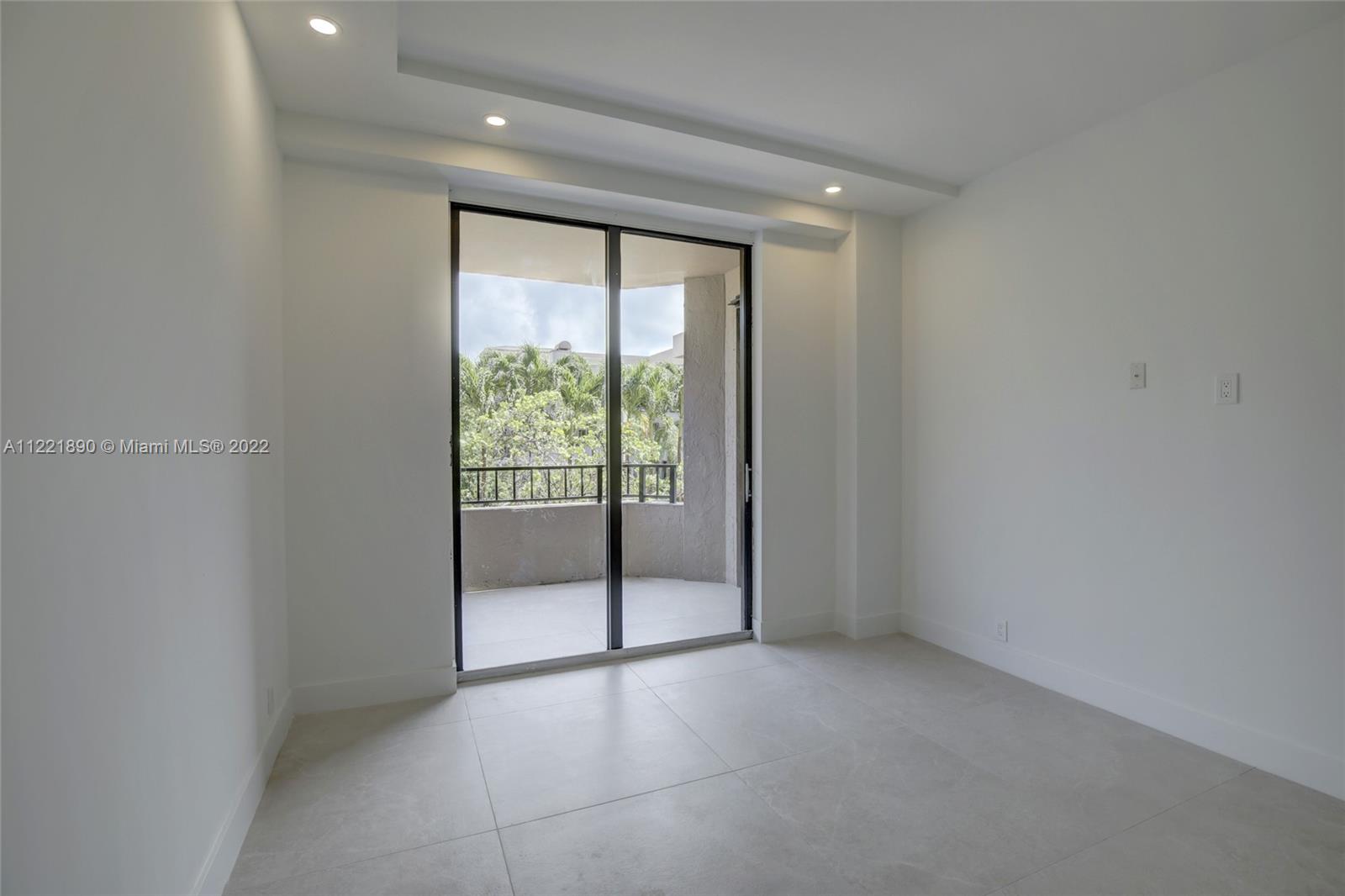 151 Crandon Boulevard, Unit 220 Key Biscayne, FL 33149 - Photo 11 of 16 a view of an empty room with glass door