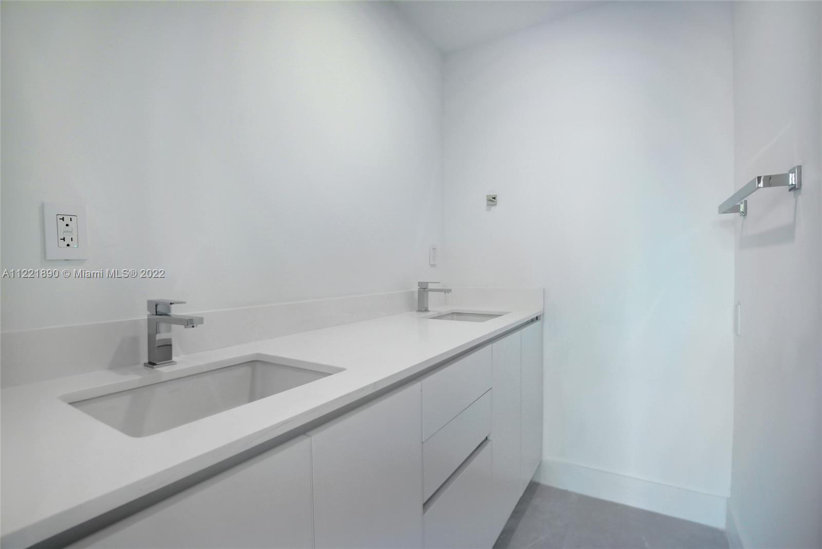 151 Crandon Boulevard, Unit 220 Key Biscayne, FL 33149 - Photo 12 of 16 a bathroom with a sink and vanity