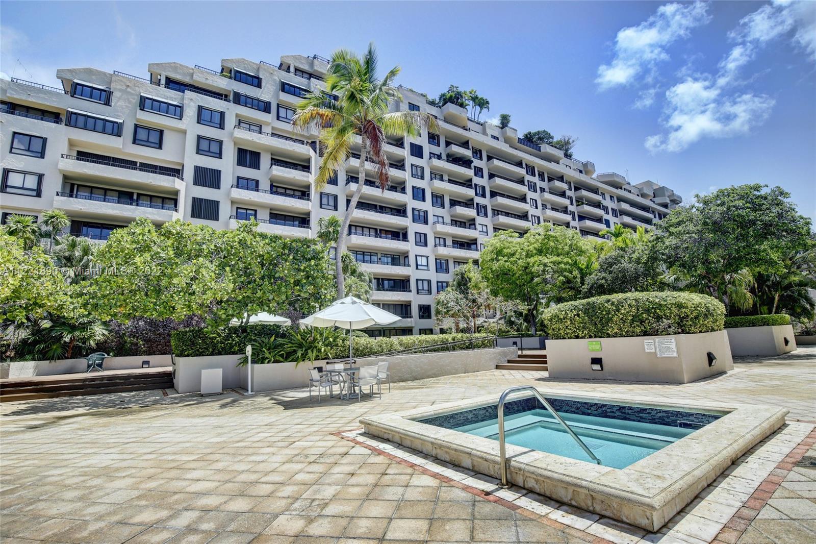 151 Crandon Boulevard, Unit 220 Key Biscayne, FL 33149 - Photo 13 of 16 a view of a patio with plants and chairs