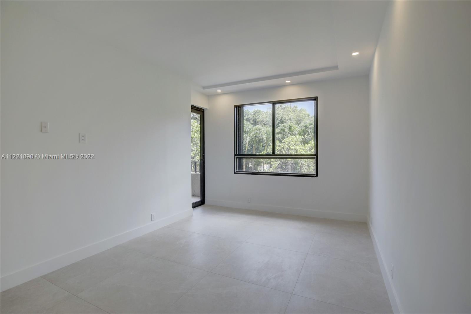 151 Crandon Boulevard, Unit 220 Key Biscayne, FL 33149 - Photo 3 of 16 an empty room with windows