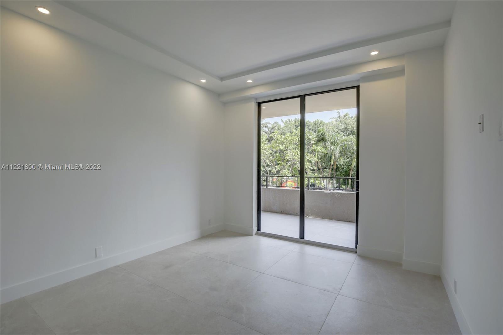 151 Crandon Boulevard, Unit 220 Key Biscayne, FL 33149 - Photo 5 of 16 a view of an empty room with glass door
