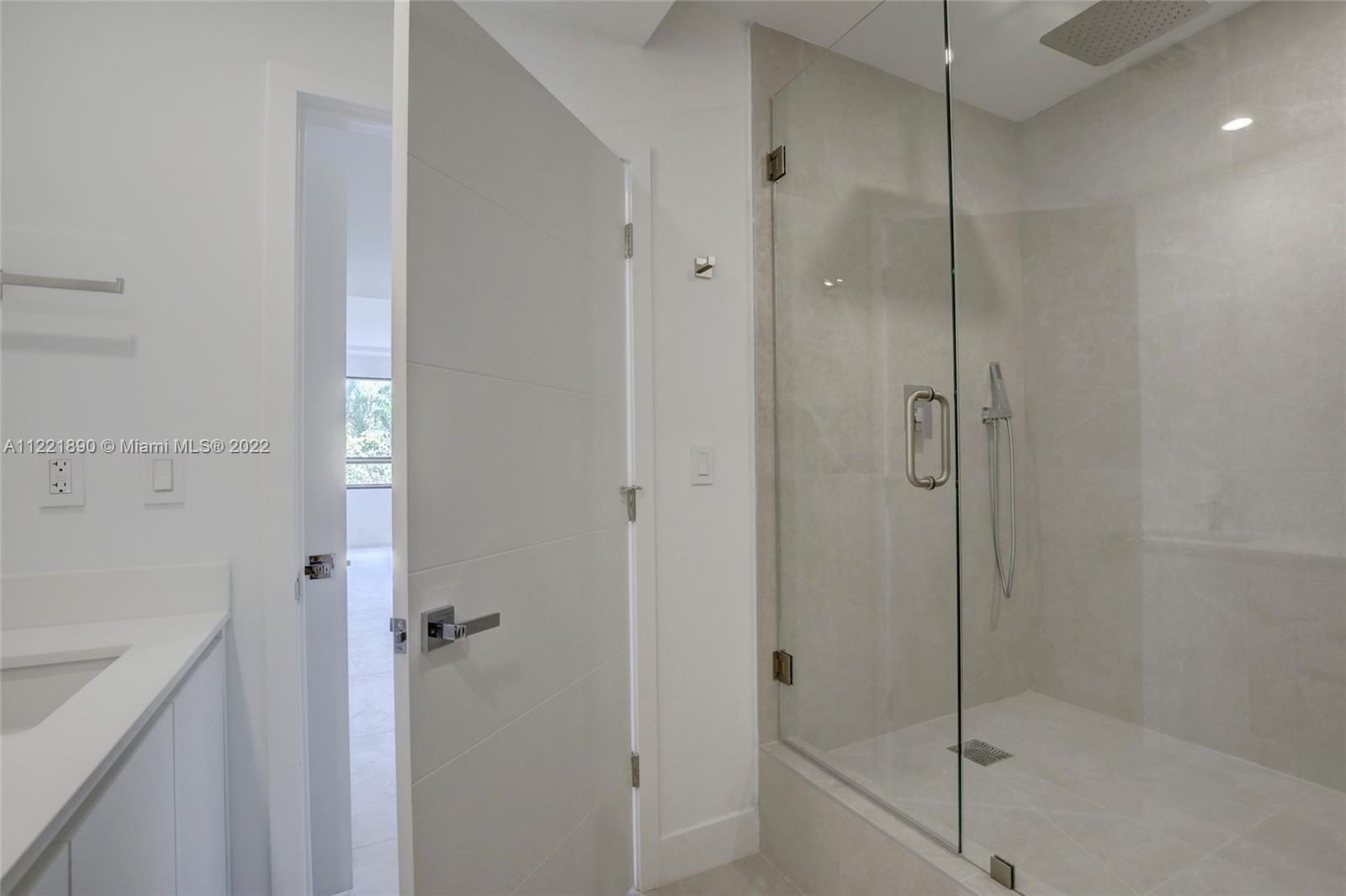 151 Crandon Boulevard, Unit 220 Key Biscayne, FL 33149 - Photo 7 of 16 a bathroom with a shower