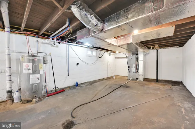 a view of a room with wooden floor and iron stairs