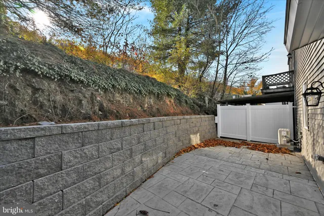 a view of a house with a small yard and a large window
