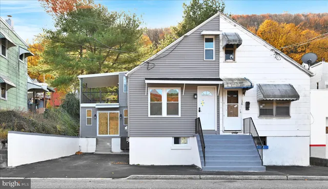 a front view of a house with a garage