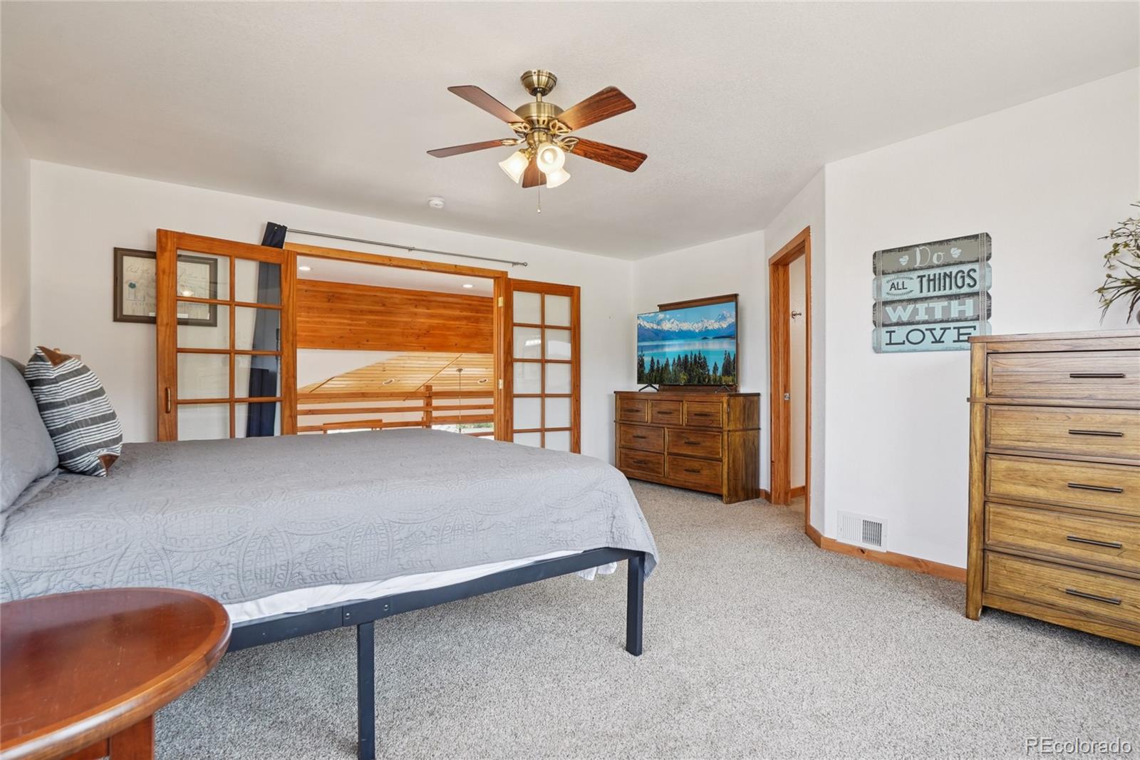 108 Hummingbird Way Granby, CO 80446 - Photo 20 of 46 a living room with furniture and a ceiling fan